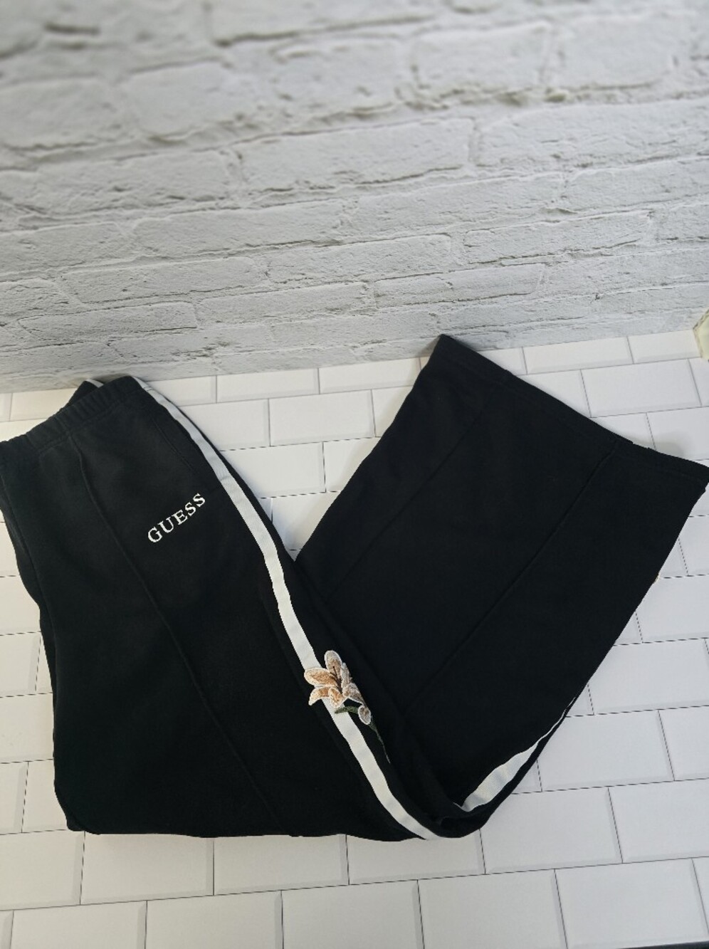 Guess Black Joggers with White Stripe and Embroidered Floral Accent